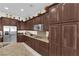 Modern kitchen features stainless appliances, granite counters, and custom cabinetry at 6739 Quapaw St, Las Vegas, NV 89149