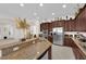 Kitchen showcasing stainless appliances, granite counters and breakfast bar seating at 6739 Quapaw St, Las Vegas, NV 89149