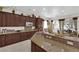 Beautiful kitchen featuring granite counters, stainless appliances, and custom cabinetry at 6739 Quapaw St, Las Vegas, NV 89149