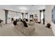 Bright living room with fireplace and large windows, filled with natural light at 6739 Quapaw St, Las Vegas, NV 89149