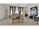 Bright living room featuring neutral tones, stylish decor, and bright natural light at 6739 Quapaw St, Las Vegas, NV 89149