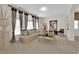 Elegant living room featuring neutral tones, stylish decor, and bright natural light at 6739 Quapaw St, Las Vegas, NV 89149