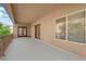 Large covered patio with french doors and mature landscaping, perfect for entertaining at 6739 Quapaw St, Las Vegas, NV 89149