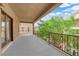 Spacious covered patio with railing and mature landscaping, perfect for outdoor enjoyment at 6739 Quapaw St, Las Vegas, NV 89149