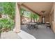 Covered patio area features comfortable seating and a ceiling fan, perfect for outdoor enjoyment at 6739 Quapaw St, Las Vegas, NV 89149