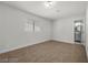 A clean, simple bedroom, features plush carpet, a window for natural light, and a doorway leading to the bathroom at 728 Carpenter Dr, Las Vegas, NV 89107