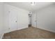 Neutral bedroom with a carpeted floor and two white doors at 728 Carpenter Dr, Las Vegas, NV 89107