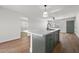 A kitchen island is showcased with modern fixtures, providing a functional space for food preparation and casual dining at 728 Carpenter Dr, Las Vegas, NV 89107