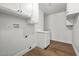 Bright laundry room with cabinets and sleek hardwood floors at 728 Carpenter Dr, Las Vegas, NV 89107