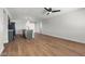 Open living space featuring luxury vinyl flooring, kitchen with an island, and a modern design creating a spacious feel at 728 Carpenter Dr, Las Vegas, NV 89107