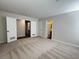 Spacious bedroom with neutral carpeting and sliding door closet offers ample space at 8010 Coffee Tree Ct, Las Vegas, NV 89123