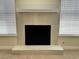 Close-up of fireplace with tile surround and plenty of natural light at 8010 Coffee Tree Ct, Las Vegas, NV 89123