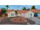 Charming one-story home featuring desert landscaping and an attached two-car garage at 8010 Coffee Tree Ct, Las Vegas, NV 89123
