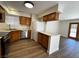 Open-concept kitchen with white countertops, modern stainless steel appliances, and wooden cabinets at 8010 Coffee Tree Ct, Las Vegas, NV 89123
