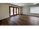 The living room features hardwood floors and direct access to the patio at 8010 Coffee Tree Ct, Las Vegas, NV 89123