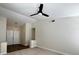Spacious living room with new carpet, fresh paint, and a ceiling fan at 8010 Coffee Tree Ct, Las Vegas, NV 89123