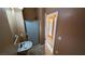 Bathroom featuring shower stall, white pedestal sink and tile floor at 8159 Base Camp Ave, Las Vegas, NV 89178