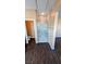 Modern bathroom featuring tiled glass shower and dark wood floors at 8159 Base Camp Ave, Las Vegas, NV 89178