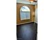 Bedroom with a large window, blinds, and hard wood flooring at 8159 Base Camp Ave, Las Vegas, NV 89178