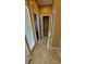 Hallway features tile flooring, storage closet, and neutral paint at 8159 Base Camp Ave, Las Vegas, NV 89178