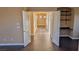 Hallway with entry to living space with built-in shelving and ample light at 8159 Base Camp Ave, Las Vegas, NV 89178