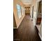 Hallway area featuring wood floors, neutral walls, and several windows and doorways at 8159 Base Camp Ave, Las Vegas, NV 89178