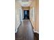 Hallway area featuring wood floors, neutral walls, with windows and doorways at 8159 Base Camp Ave, Las Vegas, NV 89178
