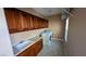 Well-appointed laundry room with cabinets, sink, and modern washer and dryer at 8159 Base Camp Ave, Las Vegas, NV 89178