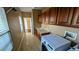 Spacious laundry area features upper cabinets, sink, and tile floors at 8159 Base Camp Ave, Las Vegas, NV 89178