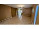 Open concept living room with tile flooring, views to the staircase, and ample natural light at 8159 Base Camp Ave, Las Vegas, NV 89178