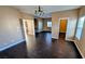 An inviting living room with dark wood floors and multiple entrances at 8159 Base Camp Ave, Las Vegas, NV 89178
