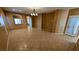 Spacious living room with tile floors, modern lighting, and an archway to the kitchen at 8159 Base Camp Ave, Las Vegas, NV 89178