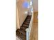 Wood-look stairs with white banister and tile flooring at 8159 Base Camp Ave, Las Vegas, NV 89178