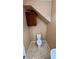 Small toilet room with overhead cabinet and tile floors at 8159 Base Camp Ave, Las Vegas, NV 89178