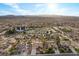 A neighborhood showcasing well-maintained homes, mature trees, and a tranquil atmosphere against a city backdrop at 835 Market Crest Dr, Las Vegas, NV 89110