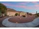 Beautiful property featuring desert landscaping, mountain views, and spacious covered patio at 835 Market Crest Dr, Las Vegas, NV 89110