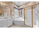 Well-lit bathroom showcases a large corner tub, a glass enclosed shower, and a vanity area at 835 Market Crest Dr, Las Vegas, NV 89110