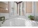 Close up of a soaking tub nook showing shutters, a leafy green plant, and gold hardware at 835 Market Crest Dr, Las Vegas, NV 89110