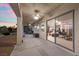 An inviting covered patio with ceiling fans and ample space for relaxing and entertaining at 835 Market Crest Dr, Las Vegas, NV 89110
