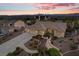 Charming single-story home with a three-car garage, well-maintained landscaping, and serene neighborhood setting at sunset at 835 Market Crest Dr, Las Vegas, NV 89110