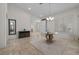 Welcoming foyer with a modern chandelier, decor, and stone floors set a tone of sophisticated charm at 835 Market Crest Dr, Las Vegas, NV 89110