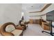 Inviting home office with built-in desk and shelves, comfortable seating, and ample natural light at 835 Market Crest Dr, Las Vegas, NV 89110