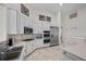 Well-lit kitchen featuring white cabinets, stainless steel appliances, and ample countertop space at 835 Market Crest Dr, Las Vegas, NV 89110