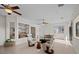 Open-concept living area with comfortable seating, and views of the kitchen and outdoor scenery at 835 Market Crest Dr, Las Vegas, NV 89110