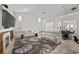Spacious living room with a cozy fireplace, plush sofas, and modern decor offers style and comfort at 835 Market Crest Dr, Las Vegas, NV 89110