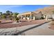 A charming single-story home with desert landscaping in the backyard and mountain views at 835 Market Crest Dr, Las Vegas, NV 89110