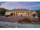A charming single-story home with desert landscaping in the backyard and mountain views at 835 Market Crest Dr, Las Vegas, NV 89110