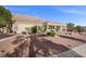 A charming single-story home with desert landscaping in the backyard and mountain views at 835 Market Crest Dr, Las Vegas, NV 89110