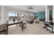 Large recreation room with exercise equipment, lounge area, and stunning views outside at 835 Market Crest Dr, Las Vegas, NV 89110