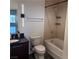 Modern bathroom featuring a shower over tub, dark vanity, and sleek lighting at 900 Las Vegas Blvd # 1003, Las Vegas, NV 89101